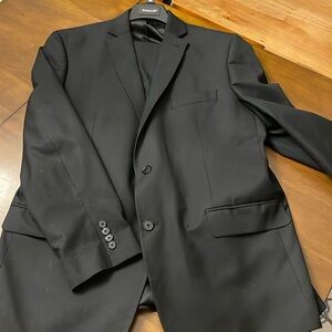 Men’s black suit-jacket is 46R, pants are 36/30